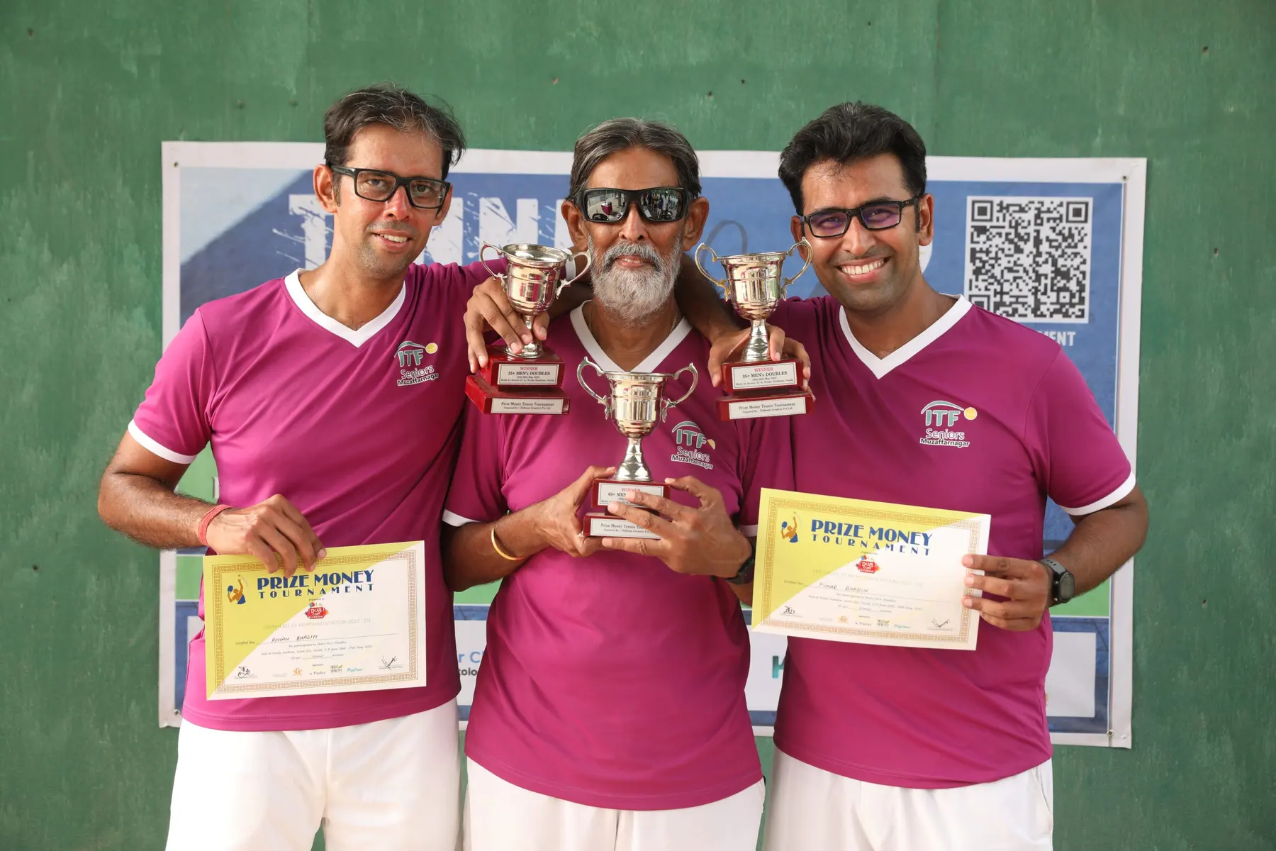 Three champions holding their RGT trophies