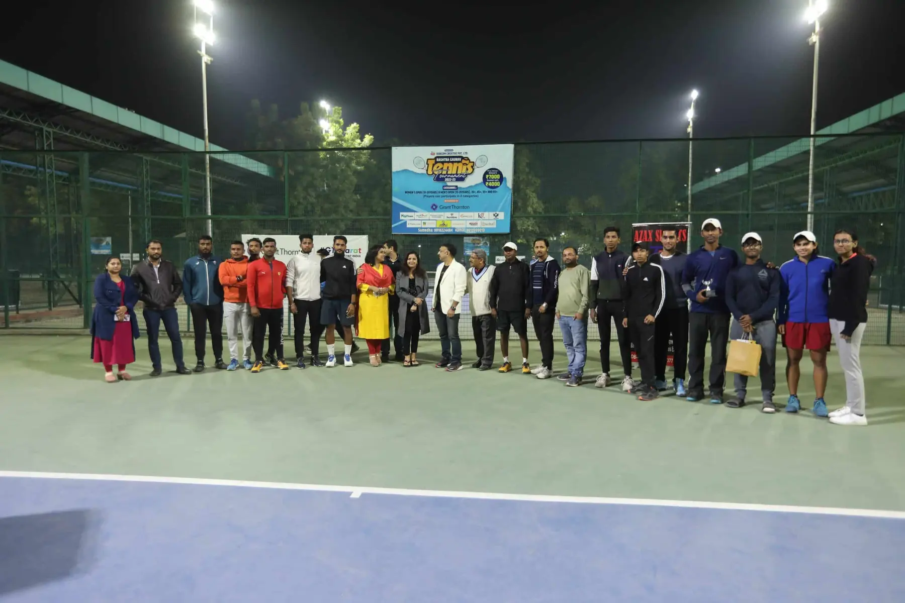 Players and organisers together under the floodlights