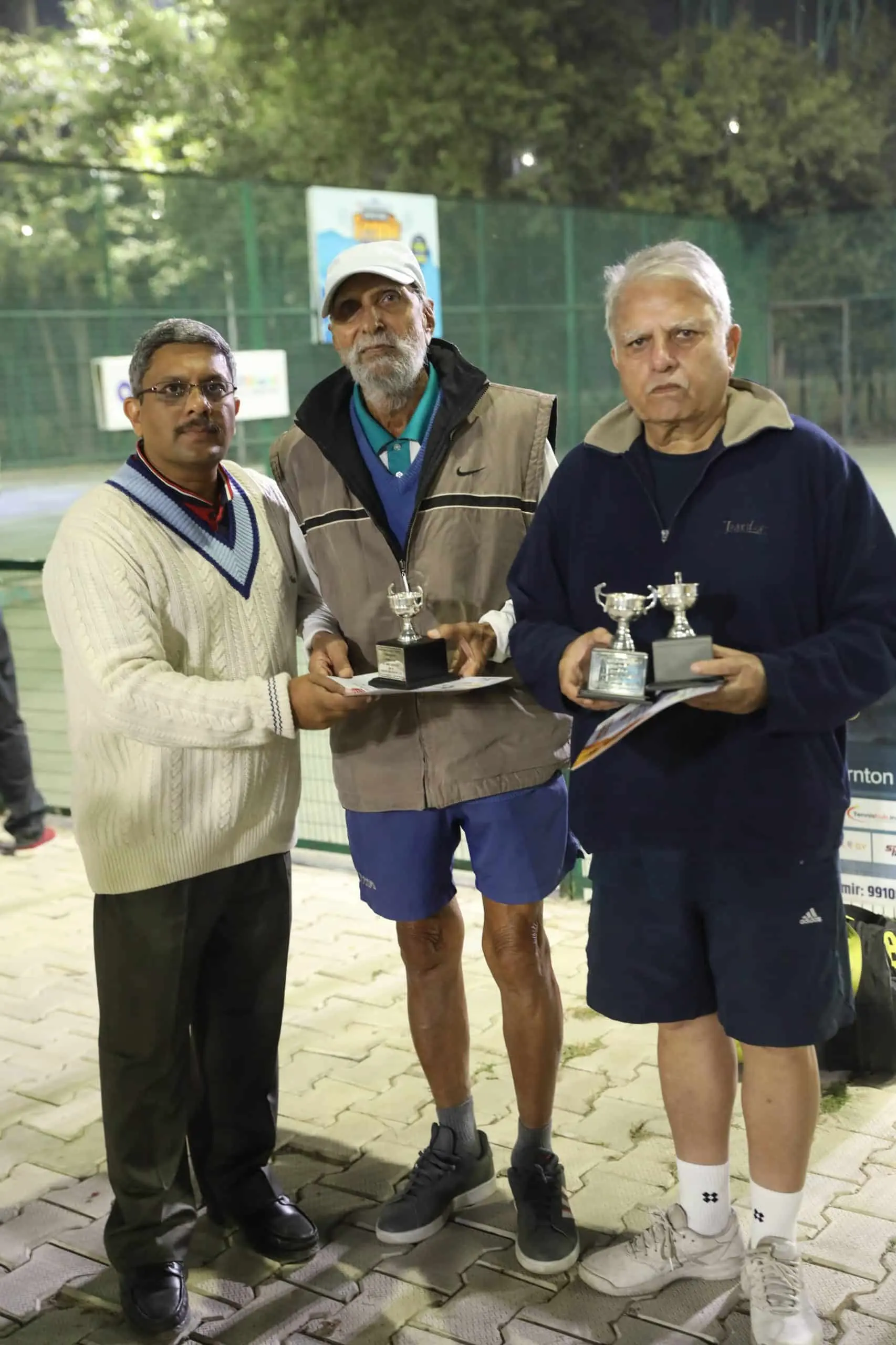 Veteran players with their trophies